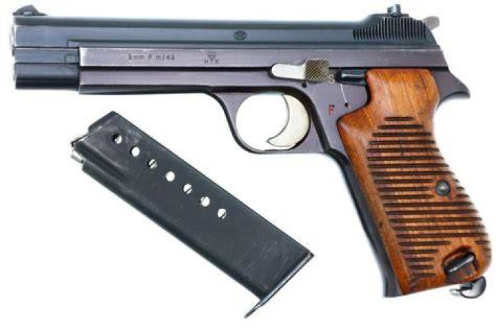 What pistol won the military contract?
