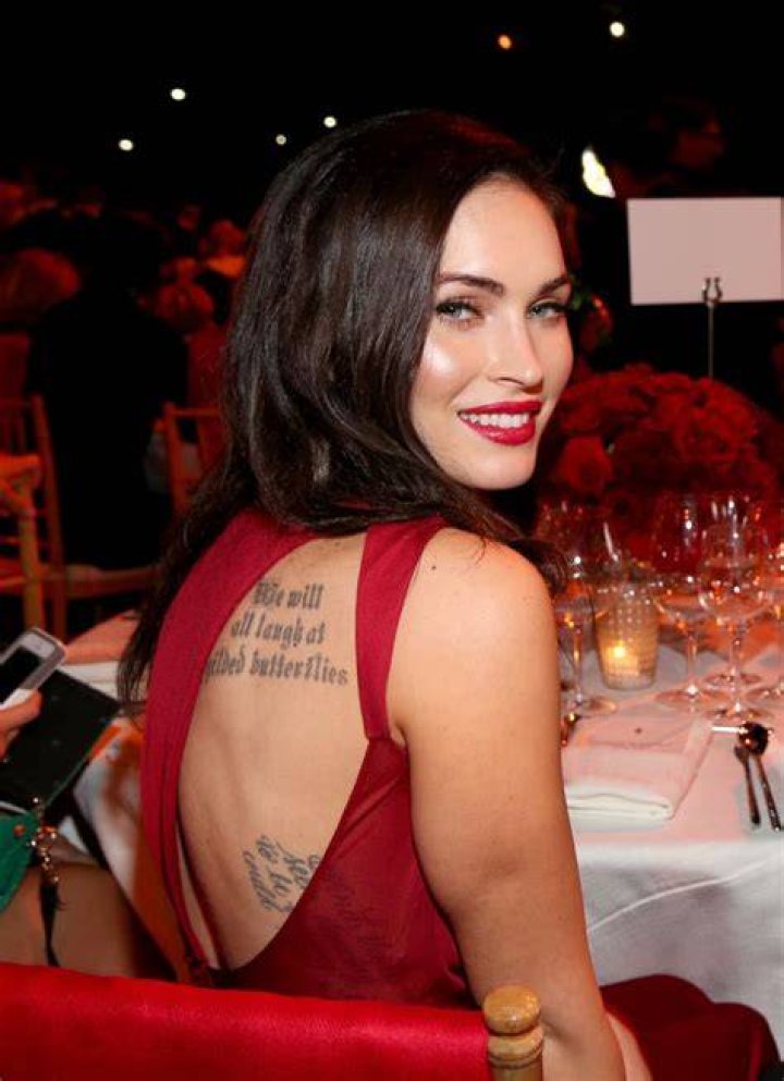 Why did Megan Fox get her tattoo removed?